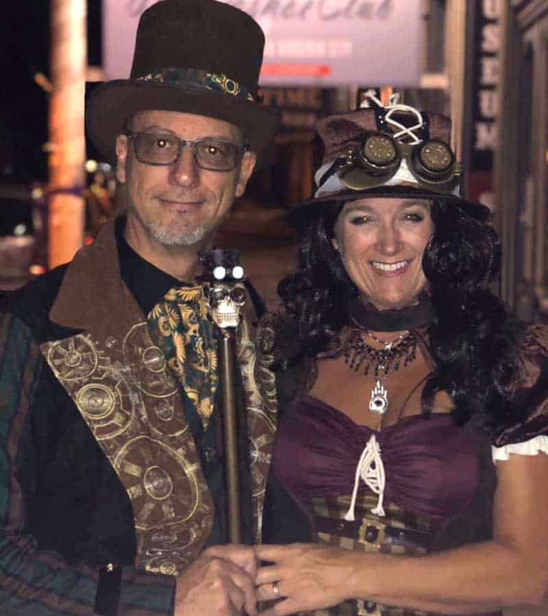 todd smith is shown in steampunk clothing with his wife.